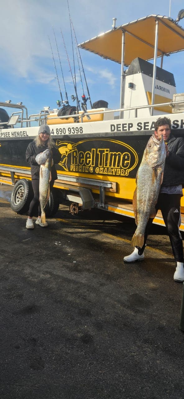 Orange rockfish with angler